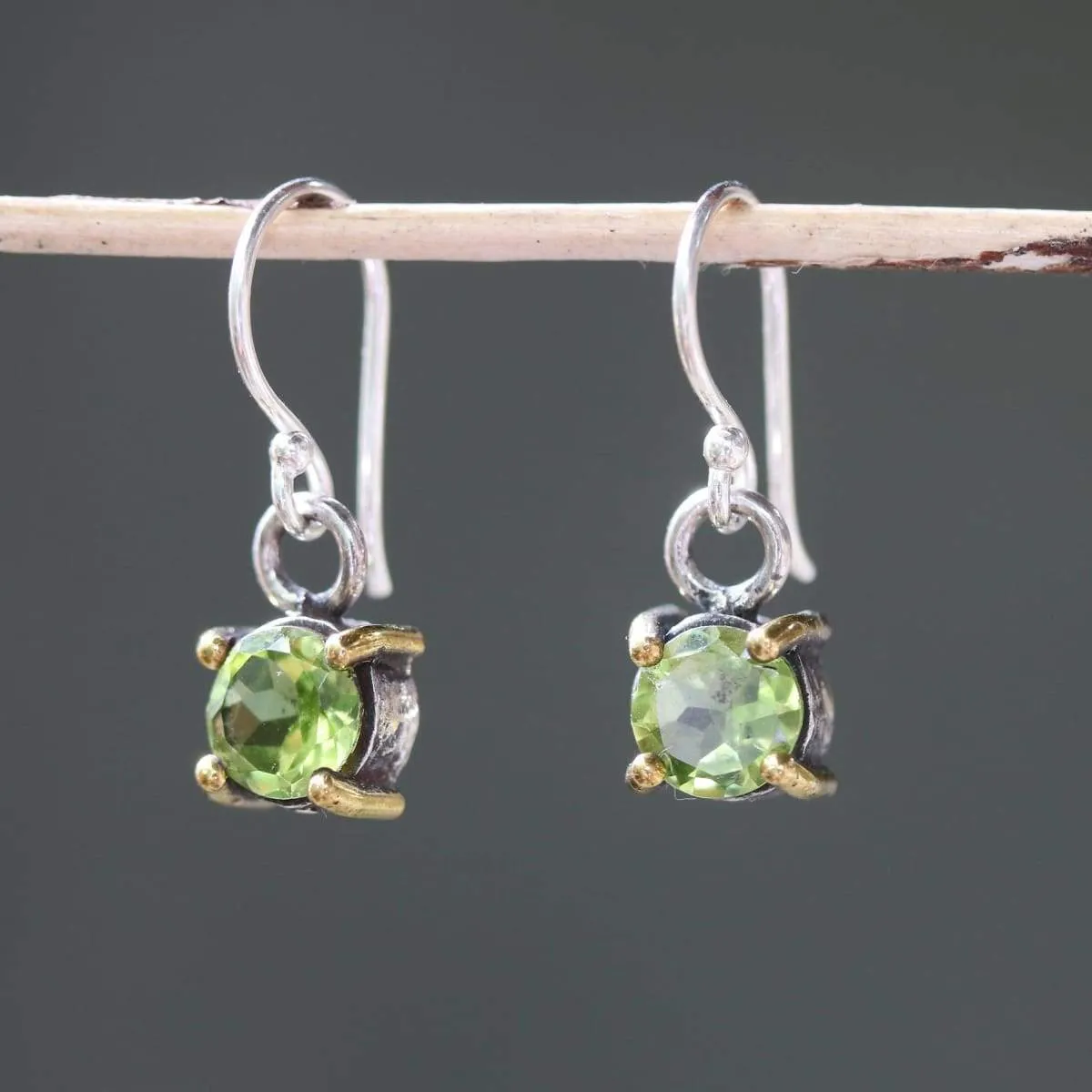 Earrings round faceted peridot in silver bezel and brass prongs setting with sterling silver hooks style