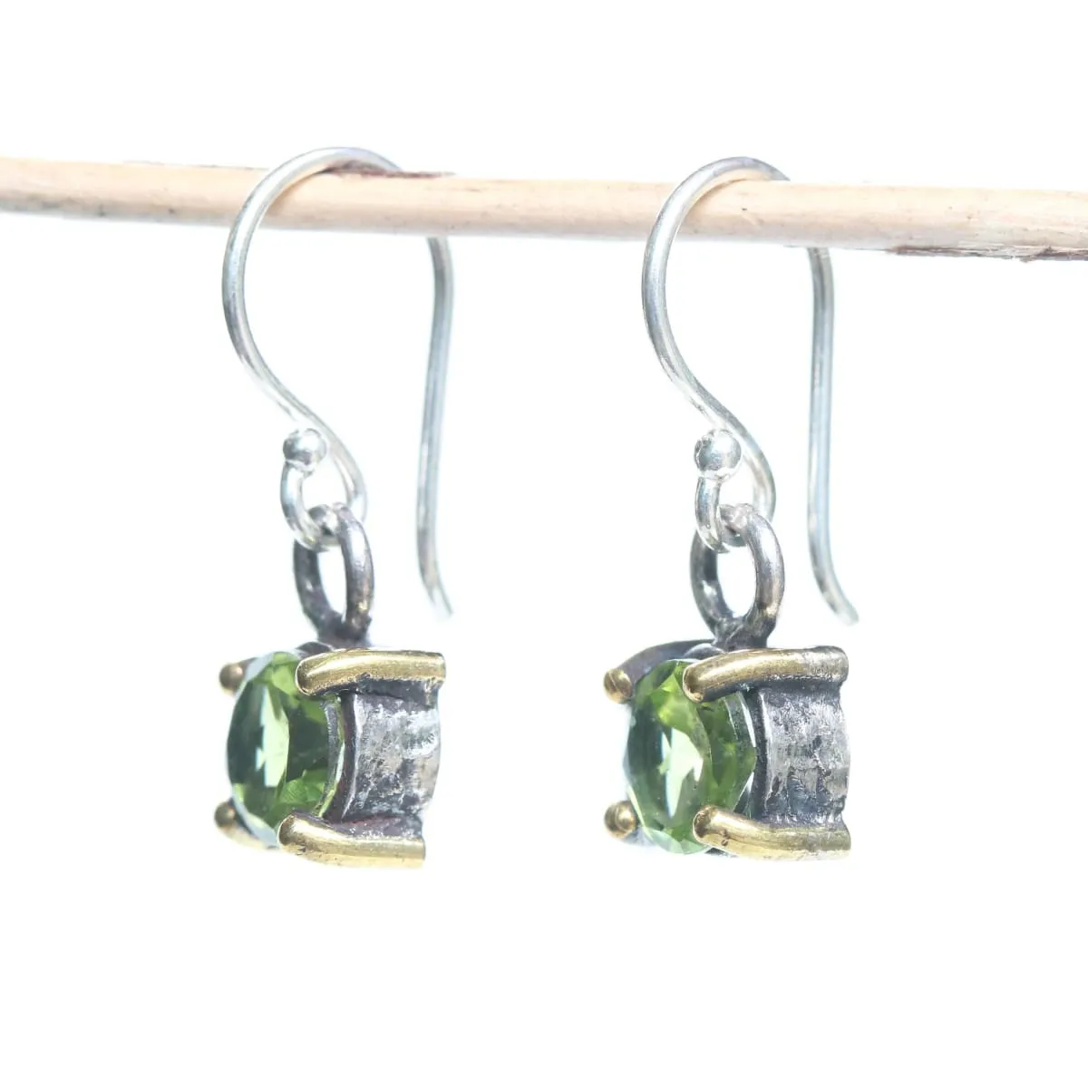 Earrings round faceted peridot in silver bezel and brass prongs setting with sterling silver hooks style